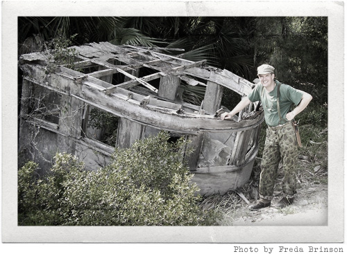 Phil Brinson beside a shipwreck